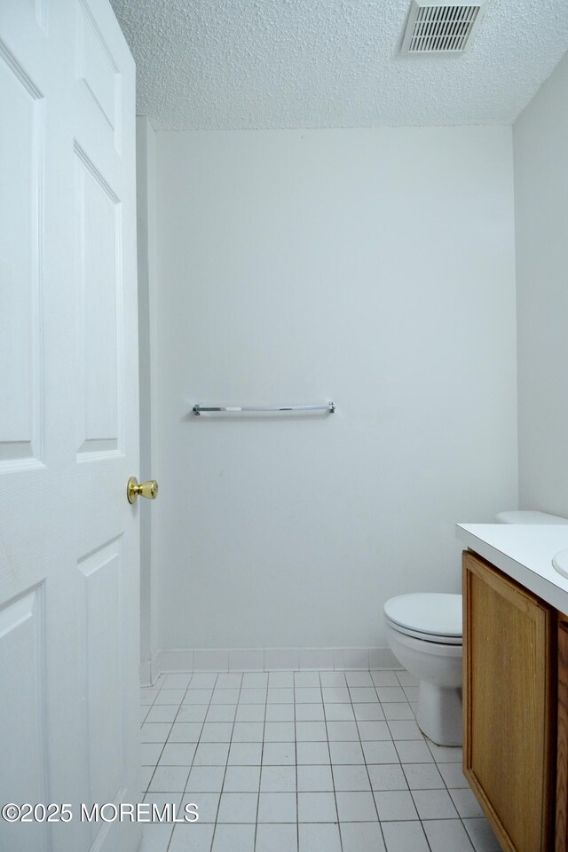111 Watson Ct, Howell, NJ 07731 - bathroom featuring vanity, toilet, a textured ceiling, baseboards, and visible vents
