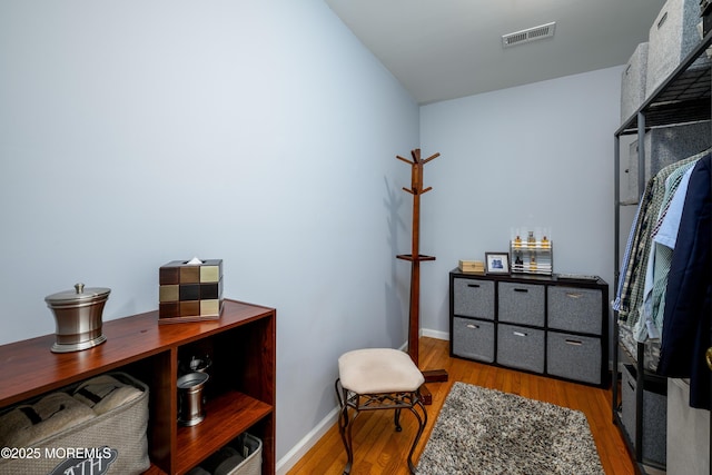 home office featuring wood finished floors and baseboards