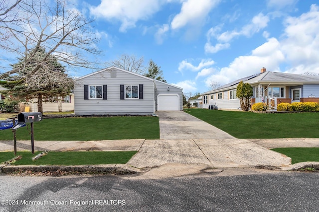 8 Venezia St, Toms River, NJ 08757 - view of front of home with a garage, a front lawn, driveway, and solar panels
