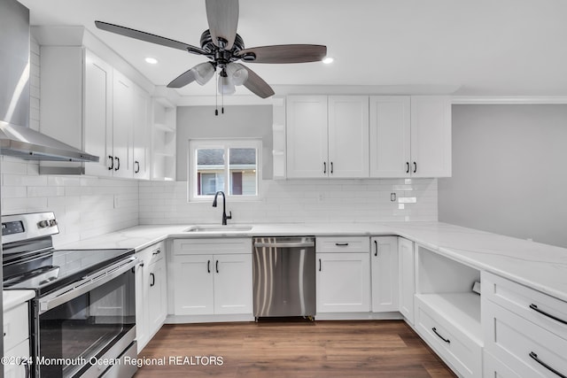 8 Venezia St, Toms River, NJ 08757 - kitchen with wall chimney range hood, stainless steel appliances, open shelves, and a sink