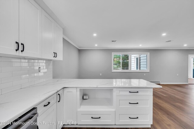 8 Venezia St, Toms River, NJ 08757 - kitchen with decorative backsplash, crown molding, wood finished floors, a baseboard radiator, and white cabinetry