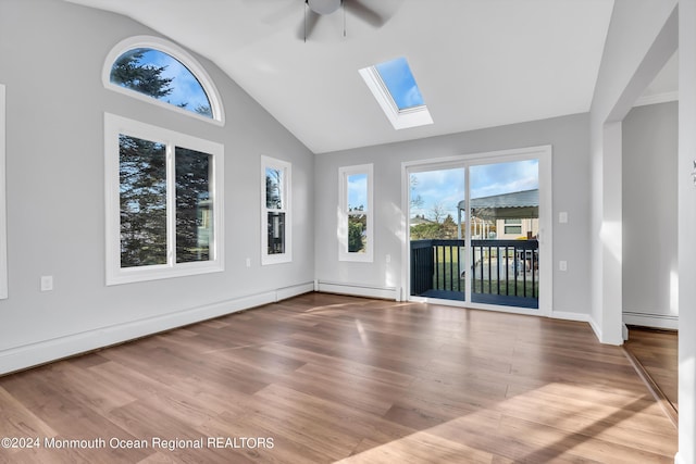 8 Venezia St, Toms River, NJ 08757 - interior space featuring wood finished floors, a skylight, ceiling fan, and a baseboard radiator