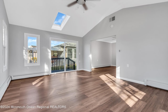 8 Venezia St, Toms River, NJ 08757 - unfurnished living room with baseboard heating, vaulted ceiling with skylight, a ceiling fan, wood finished floors, and visible vents