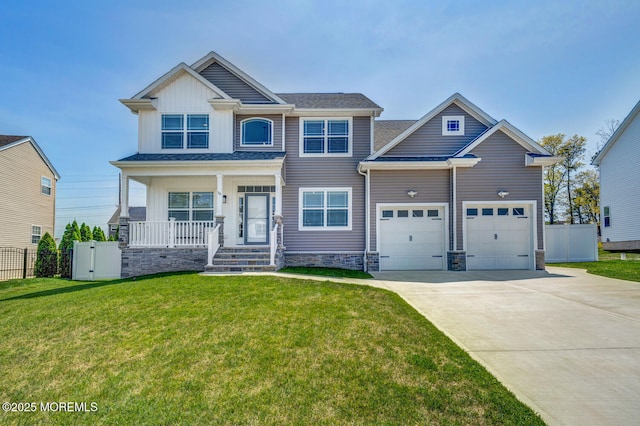 craftsman-style home with fence, concrete driveway, a porch, and a front lawn