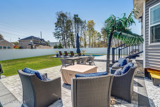 view of patio with a fenced backyard and outdoor dining space