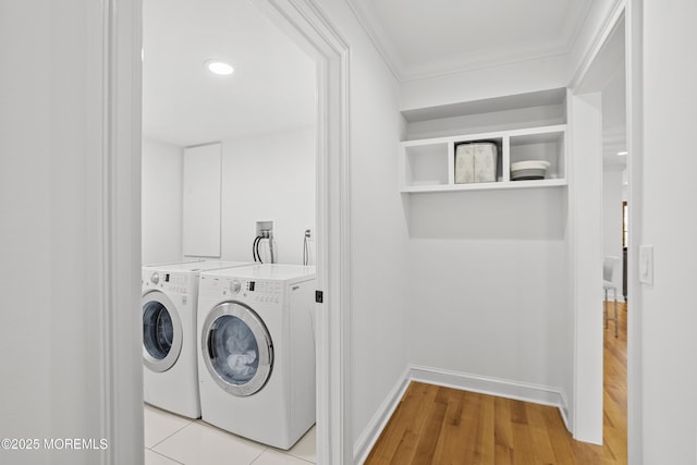 196 Highwood Rd, Oakhurst, NJ 07755 - laundry area featuring crown molding, laundry area, baseboards, light wood-type flooring, and washing machine and dryer