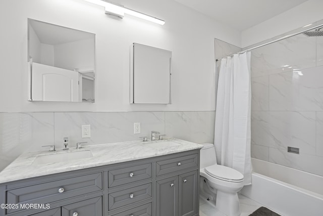 196 Highwood Rd, Oakhurst, NJ 07755 - full bath with double vanity, toilet, tile walls, and a sink