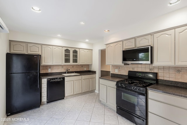 443 Lafayette Dr, Brick, NJ 08723 - kitchen featuring black appliances, a sink, dark countertops, and light tile patterned floors