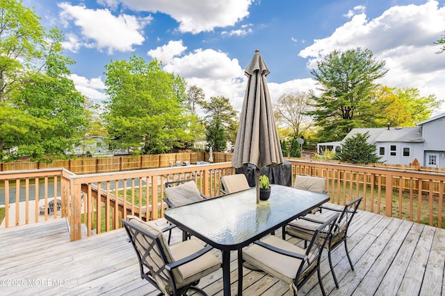 443 Lafayette Dr, Brick, NJ 08723 - wooden deck with outdoor dining area and a fenced backyard