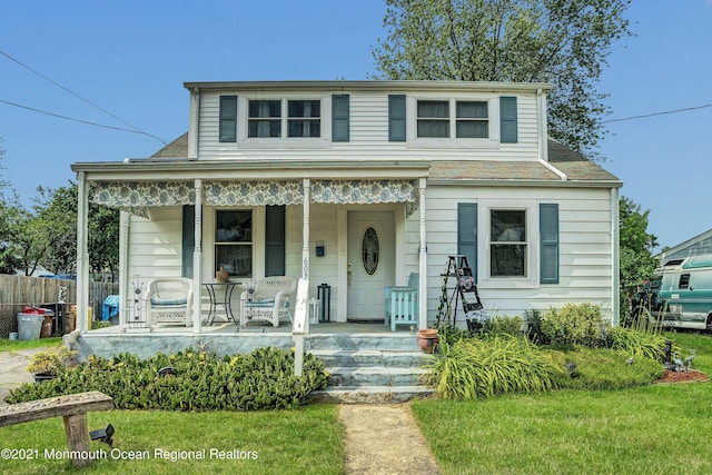 607 Willow St, Lakehurst, NJ 08733 - view of front of house featuring a porch and fence