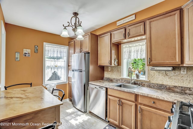 607 Willow St, Lakehurst, NJ 08733 - kitchen with a sink, appliances with stainless steel finishes, decorative backsplash, and light countertops