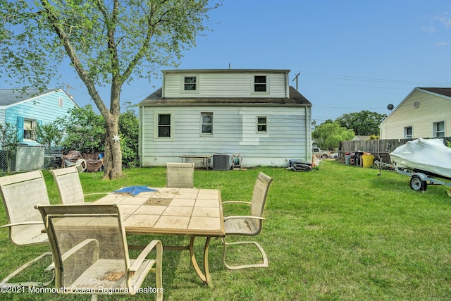 607 Willow St, Lakehurst, NJ 08733 - back of house with cooling unit, outdoor dining space, and a shingled roof