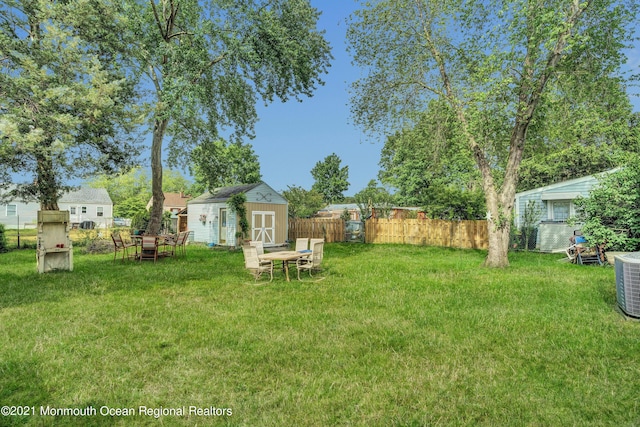 607 Willow St, Lakehurst, NJ 08733 - view of yard featuring a storage unit, an outbuilding, and cooling unit
