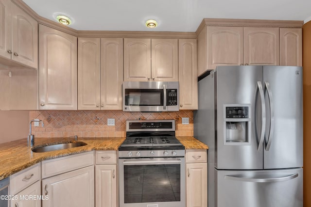 40 Anchorage Dr, Toms River, NJ 08753 - kitchen with appliances with stainless steel finishes, a sink, light stone countertops, decorative backsplash, and light brown cabinets
