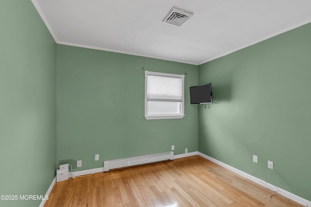 40 Anchorage Dr, Toms River, NJ 08753 - empty room with a baseboard radiator, wood finished floors, baseboards, and ornamental molding