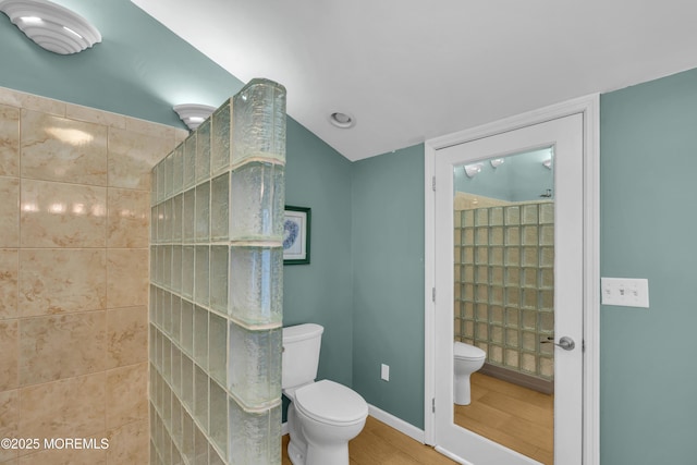 40 Anchorage Dr, Toms River, NJ 08753 - bathroom featuring toilet, wood finished floors, walk in shower, baseboards, and vaulted ceiling