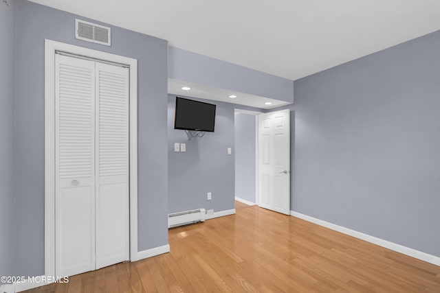 40 Anchorage Dr, Toms River, NJ 08753 - unfurnished bedroom featuring a baseboard heating unit, baseboards, light wood finished floors, recessed lighting, and a closet