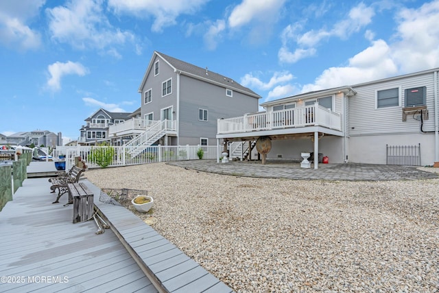 40 Anchorage Dr, Toms River, NJ 08753 - rear view of house featuring stairs, a fenced backyard, a deck, a residential view, and a patio