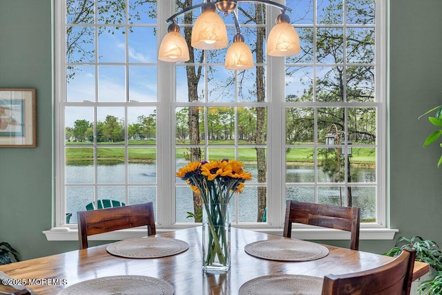 dining area featuring a water view