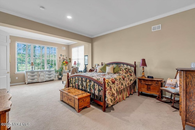 carpeted bedroom with ornamental molding and baseboards