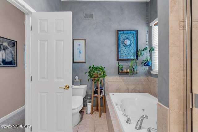 bathroom featuring a whirlpool tub, toilet, baseboards, and tile patterned floors