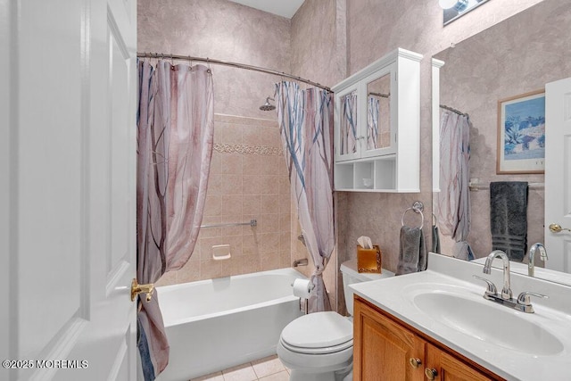 full bath with tile patterned floors, shower / bath combination with curtain, vanity, and toilet