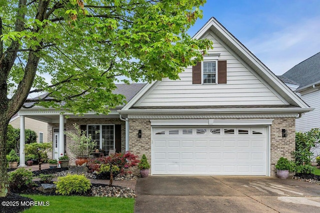 traditional-style home with driveway, brick siding, and an attached garage