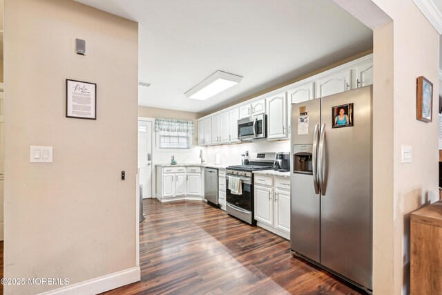 2024 Mount Carmel Blvd, Toms River, NJ 08753 - kitchen featuring white cabinetry, light countertops, dark wood-style floors, backsplash, and appliances with stainless steel finishes