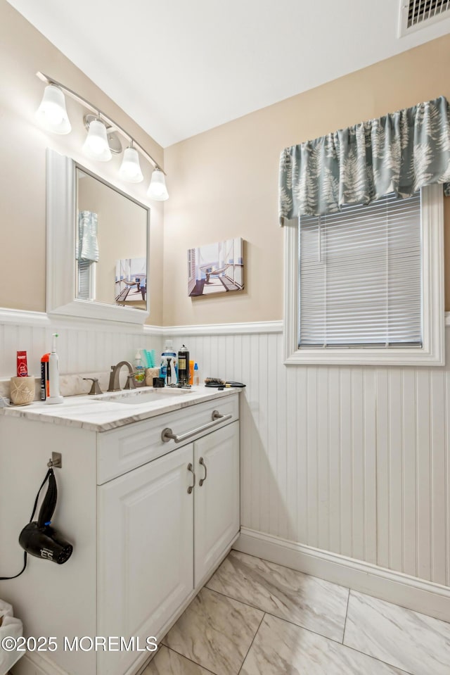 2024 Mount Carmel Blvd, Toms River, NJ 08753 - bathroom featuring marble finish floor, wainscoting, visible vents, and vanity