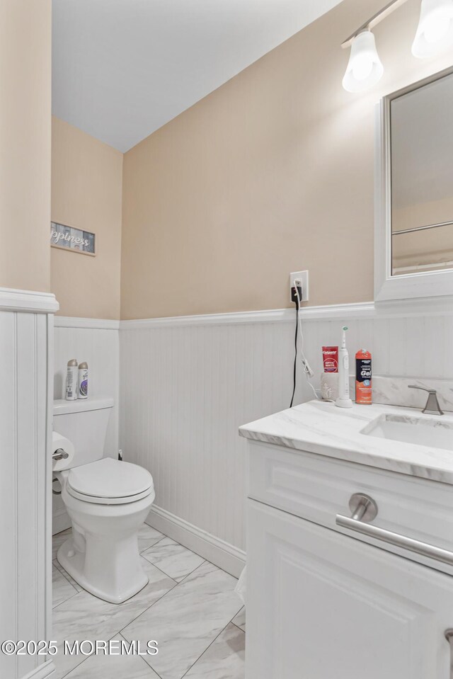 2024 Mount Carmel Blvd, Toms River, NJ 08753 - bathroom featuring wainscoting, vanity, toilet, and marble finish floor