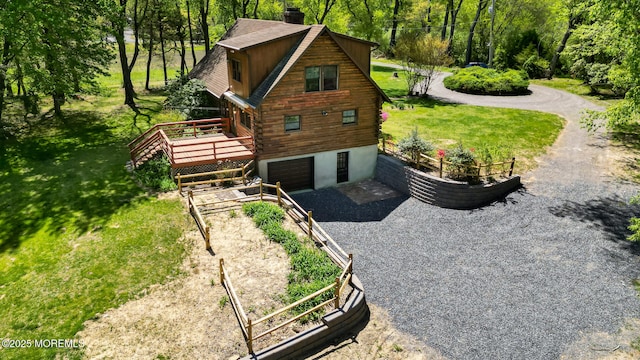 156 Baird Rd, Millstone, NJ 08535 - view of property exterior with an attached garage, a wooden deck, log exterior, a chimney, and gravel driveway