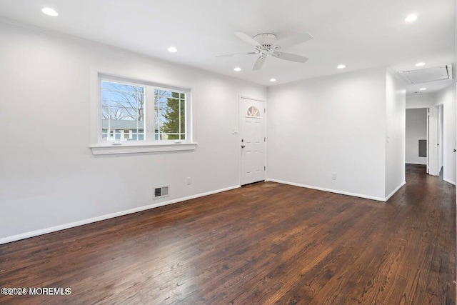 spare room with ceiling fan, attic access, recessed lighting, wood finished floors, and visible vents