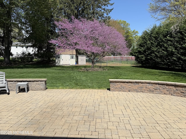 83 Campbell Ct, Freehold, NJ 07728 - view of patio with an outdoor structure and a storage unit