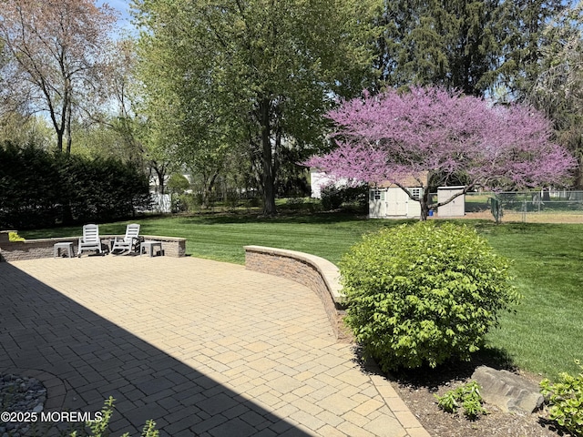 83 Campbell Ct, Freehold, NJ 07728 - view of community with a patio area, an outbuilding, and a storage unit