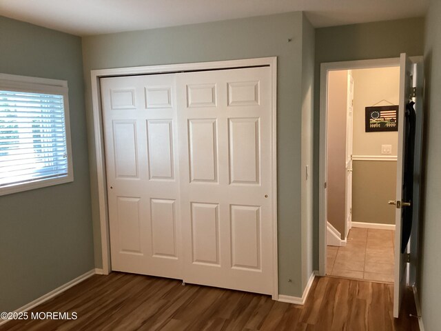 83 Campbell Ct, Freehold, NJ 07728 - unfurnished bedroom featuring a closet, baseboards, and dark wood-style floors