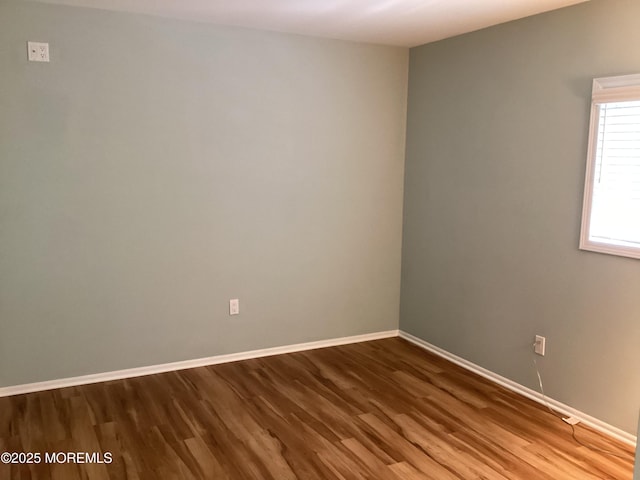 83 Campbell Ct, Freehold, NJ 07728 - empty room featuring wood finished floors and baseboards