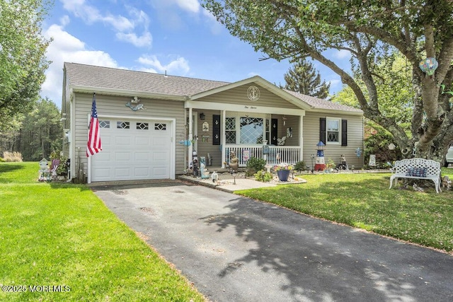 single story home with a porch, a front lawn, an attached garage, and driveway