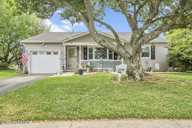 ranch-style home featuring roof with shingles, a front lawn, a garage, a porch, and driveway
