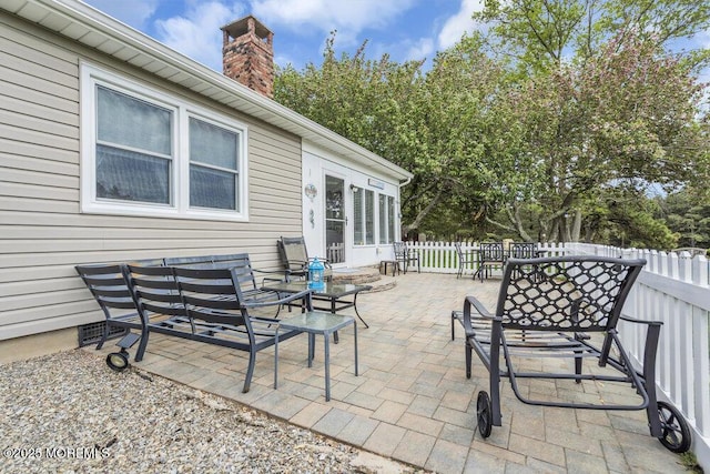 view of patio / terrace featuring fence