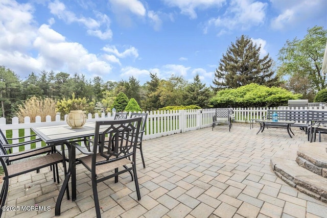view of patio / terrace with fence and outdoor dining area