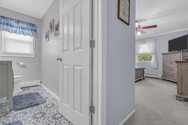 bathroom with ceiling fan, baseboard heating, vanity, toilet, and baseboards