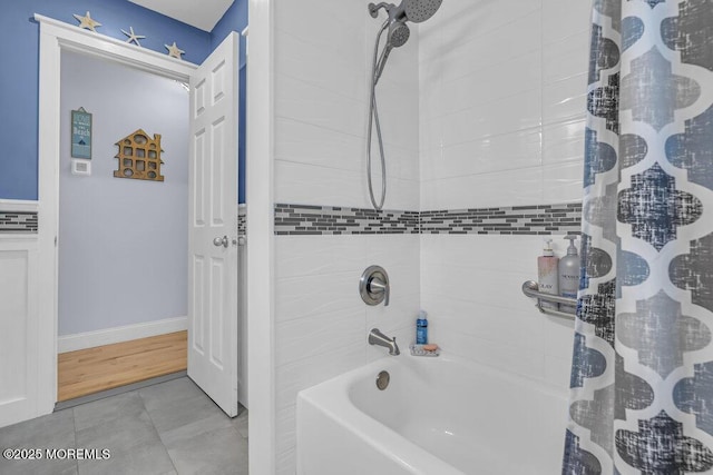 bathroom featuring tile patterned flooring and shower / bathtub combination with curtain