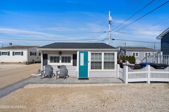 28 E Marlin Way, Lavallette, NJ 08735 - view of front of home featuring fence and roof with shingles