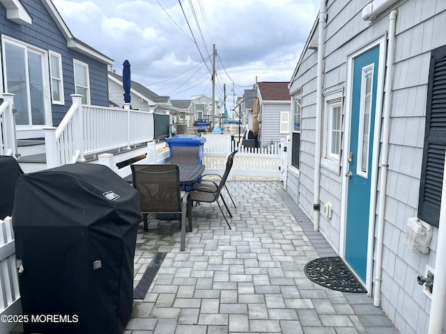 28 E Marlin Way, Lavallette, NJ 08735 - view of patio / terrace featuring a residential view, fence, outdoor dining area, and a grill