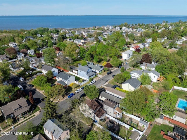 birds eye view of property with a water view and a residential view