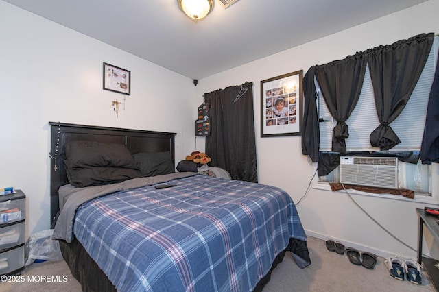 bedroom with baseboards and carpet
