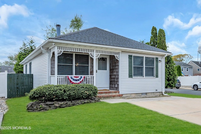 view of front of home with roof with shingles and covered porch