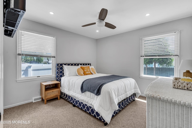 bedroom featuring multiple windows, carpet floors, recessed lighting, and baseboards