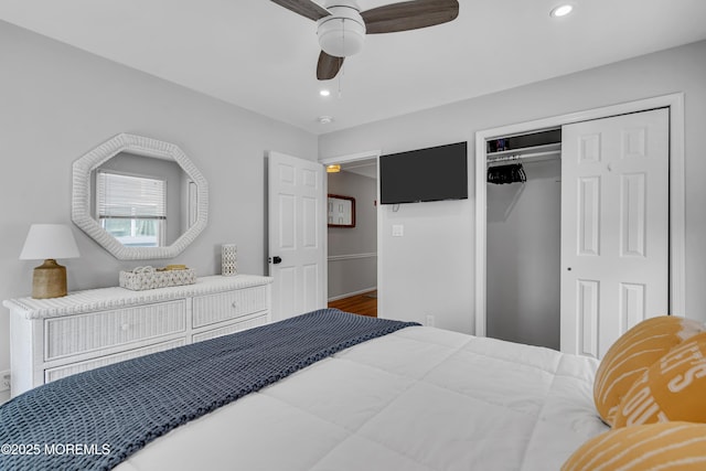 bedroom with a closet, recessed lighting, a ceiling fan, and wood finished floors