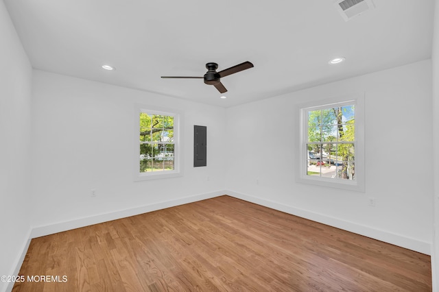 20 S St S, Keansburg, NJ 07734 - empty room with visible vents, wood finished floors, baseboards, and a healthy amount of sunlight